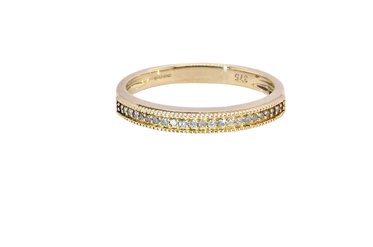 A half-hoop eternity ring set with approximately twenty-four white diamonds
