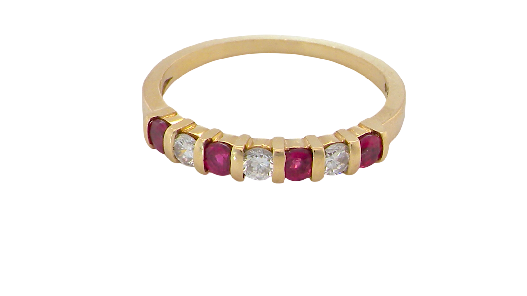 A half hoop 18 carat yellow gold eternity ring. Set with four bright red rubies, each 2.6mm (total carat weight 0.28