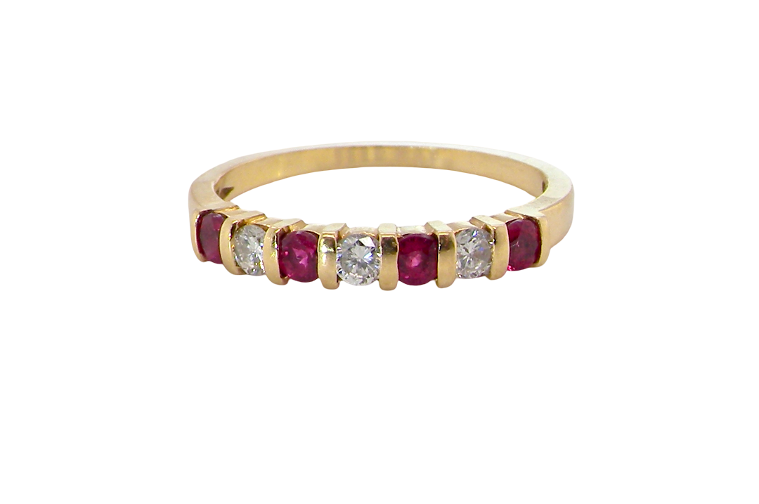A half hoop 18 carat yellow gold eternity ring. Set with four bright red rubies, each 2.6mm (total carat weight 0.28 est)