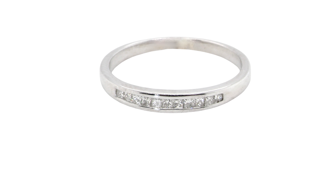 A half hoop 9 carat white gold eternity ring.
Channel set with 11 Princess cut white diamonds,
