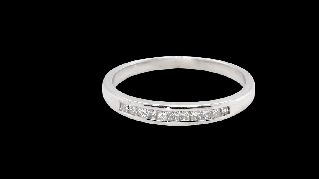 A half hoop 9 carat white gold eternity ring.
Channel set with Princess cut white diamonds,