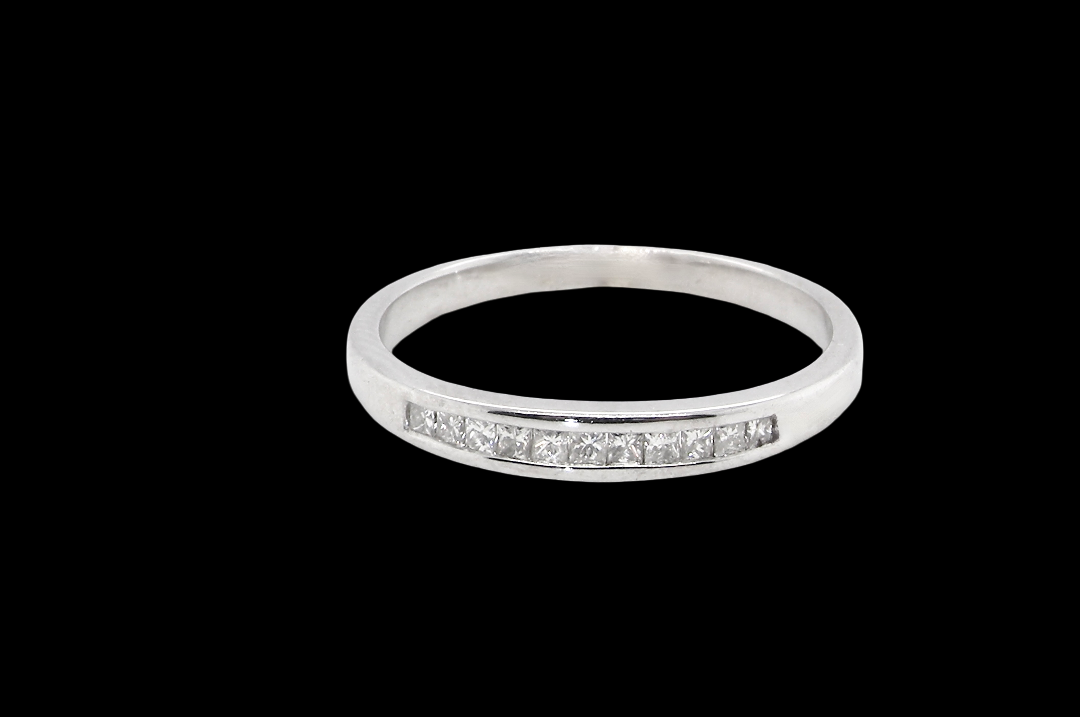 A half hoop 9 carat white gold eternity ring.
Channel set with Princess cut white diamonds,
