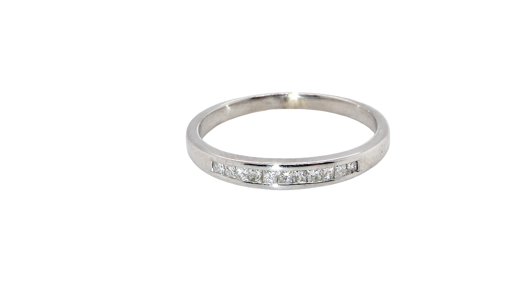 A half hoop 9 carat white gold eternity ring.
Channel set with eleven Princess cut white diamonds,