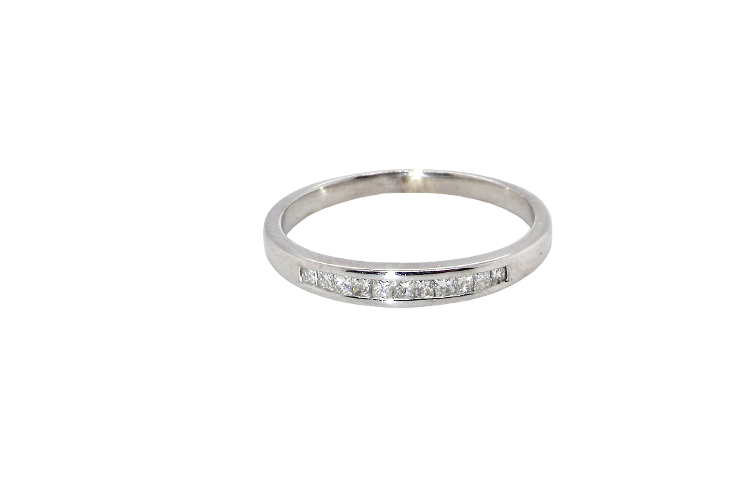 A half hoop 9 carat white gold eternity ring.
Channel set with eleven Princess cut white diamonds,
