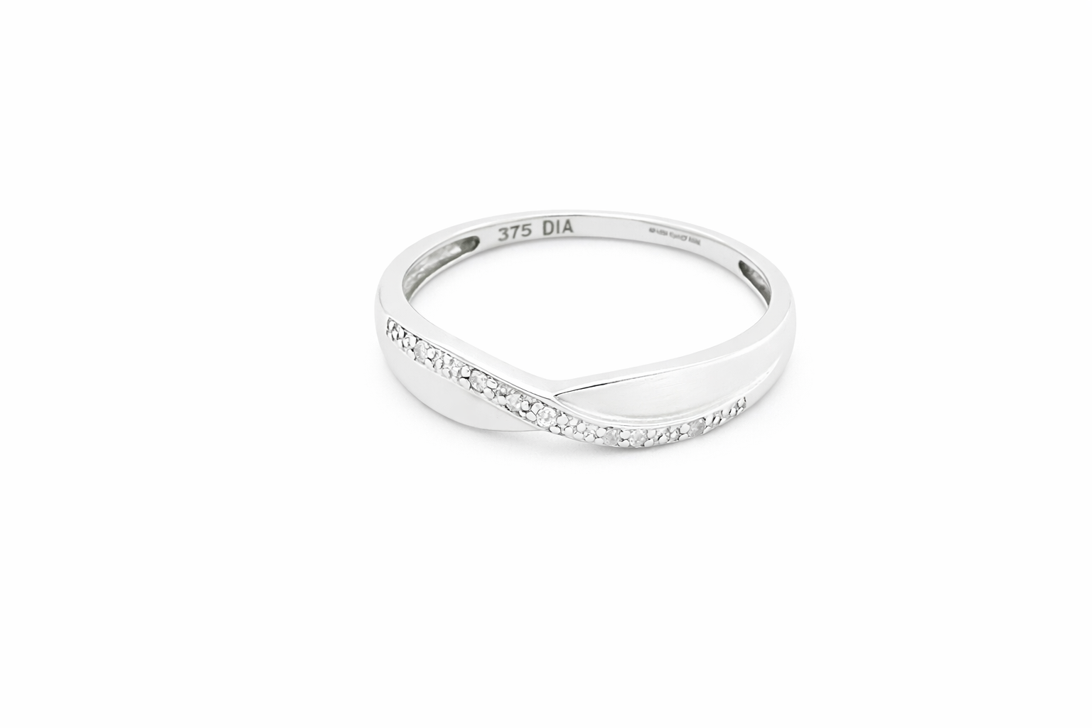 A half hoop 9 carat white gold eternity ring. Set with five small white diamonds, each 1.3mm (total 0.05 carats)