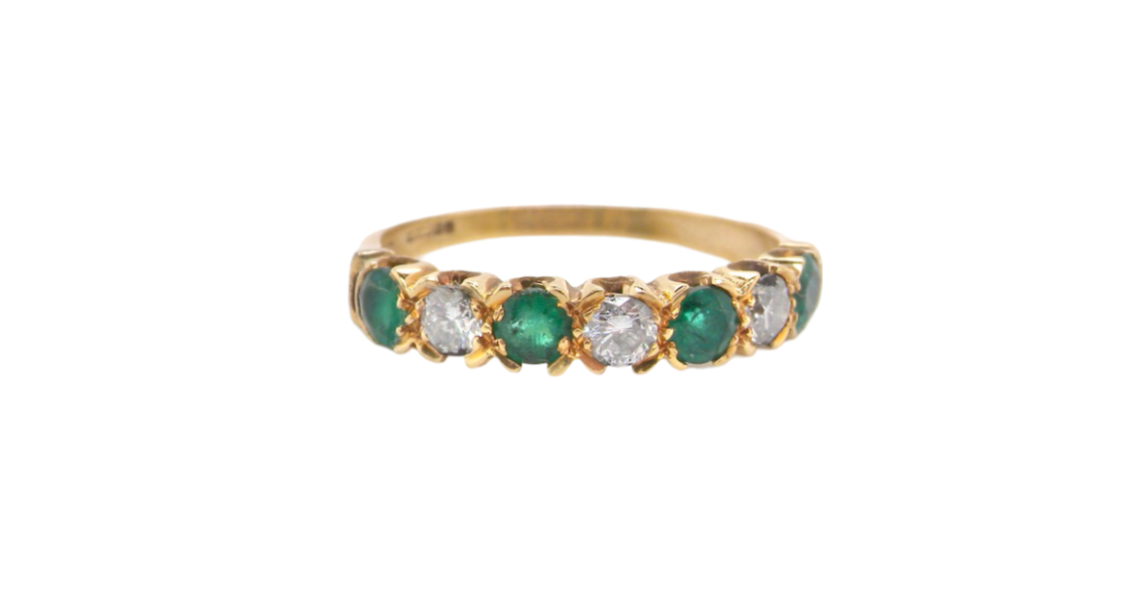 A half hoop Emerald and Diamond ring