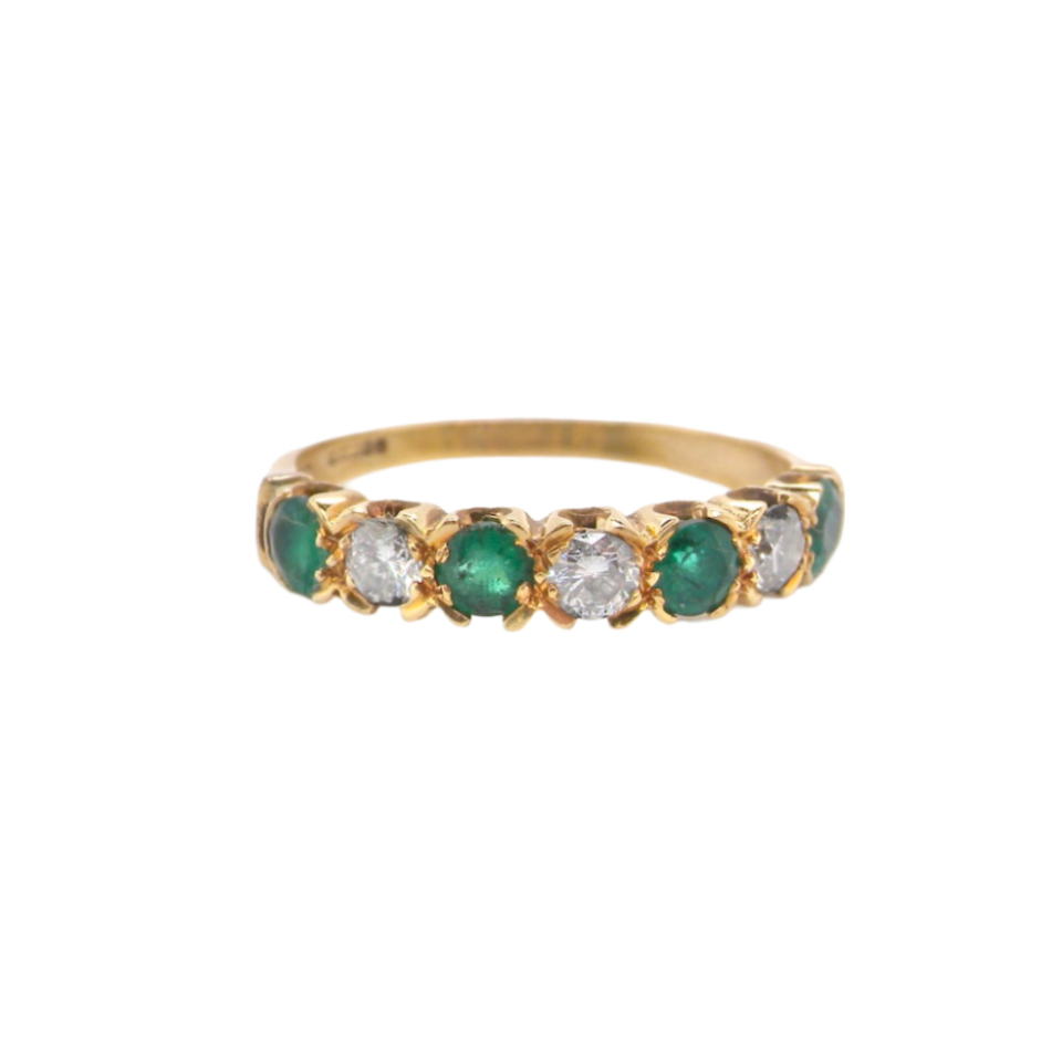 A half hoop Emerald and Diamond ring