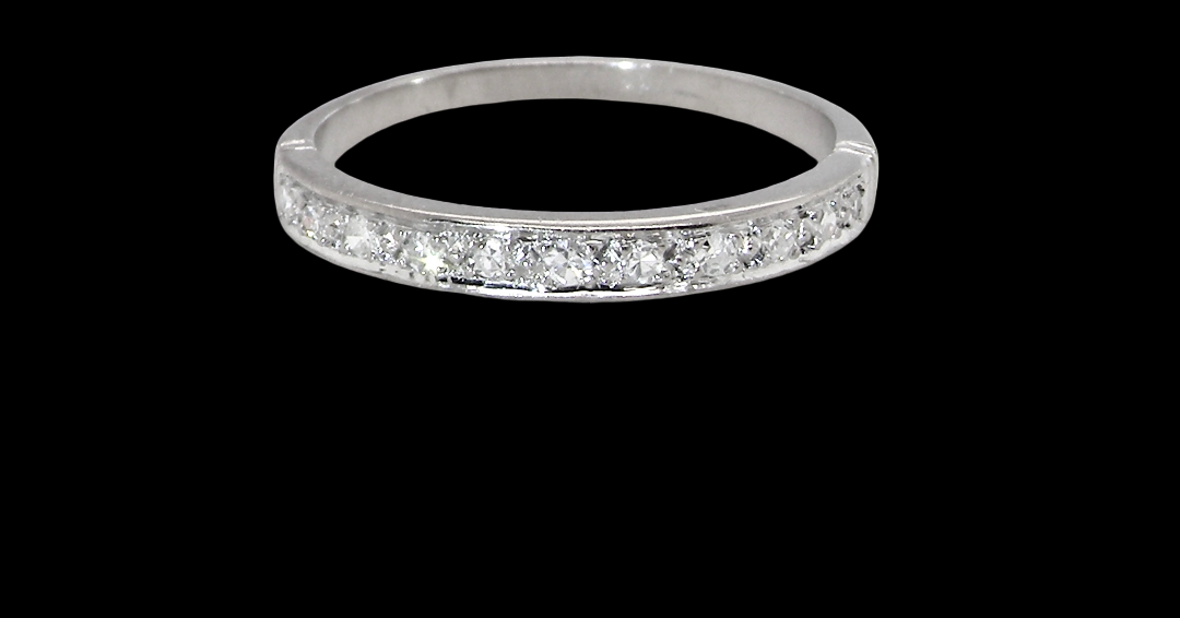 A half hoop eternity ring. Set with eleven small white diamonds, brilliant cut 2mm each (total est 0.33 carats)