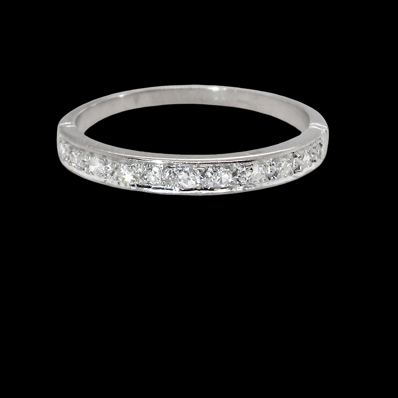 A half hoop eternity ring. Set with eleven small white diamonds, brilliant cut 2mm each (total est 0.33 carats)