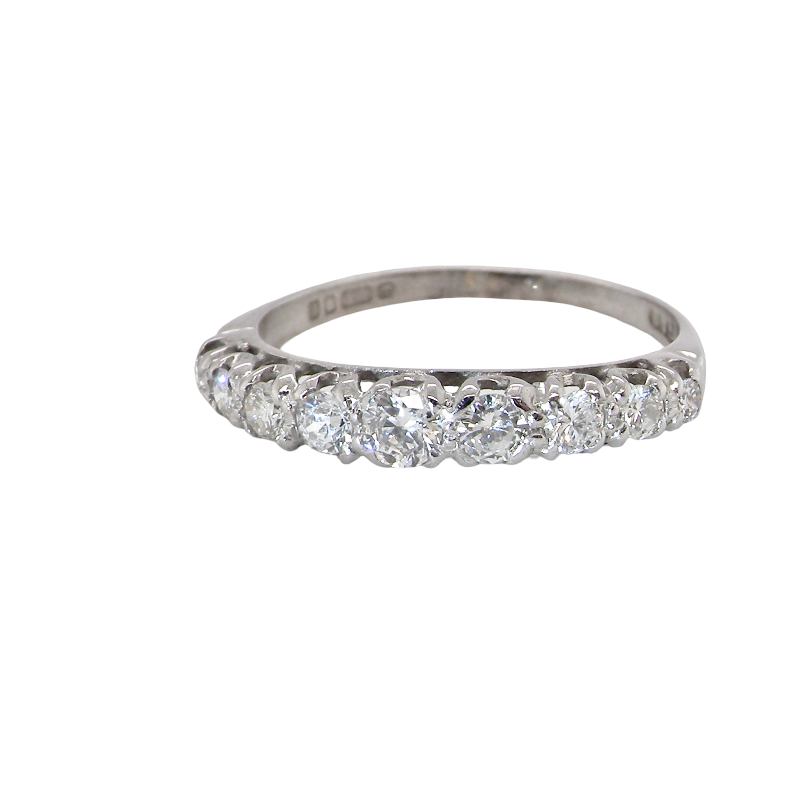 A half hoop ring set with nine brilliant cut white diamonds. These silghtly graduate from 2mm to the centre stone 3.5mm . Total carat weight estimated at 0.90 carats. Colour i-j, clarity Si