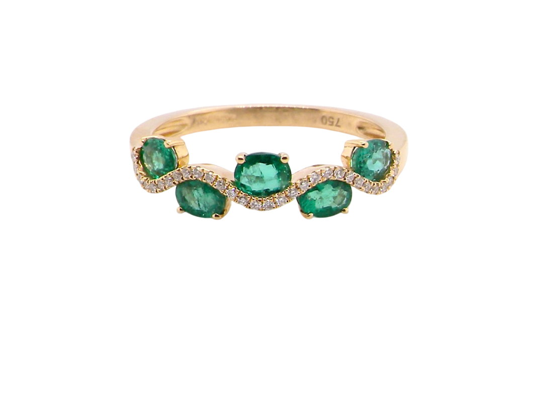 A half hoop ring with a very attractive line of oval cut emeralds, each 4x3mm, a lovely deep grass green hue, and with very good clarity too.
