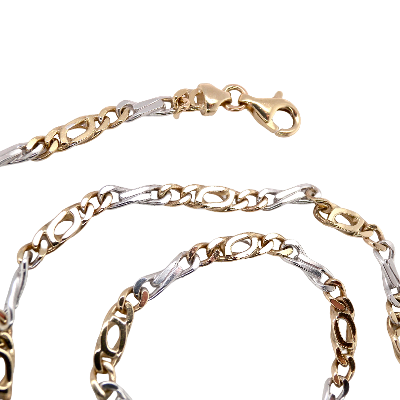 A heavy 9 carat gold neck chain. 2 colour gold, white and yellow