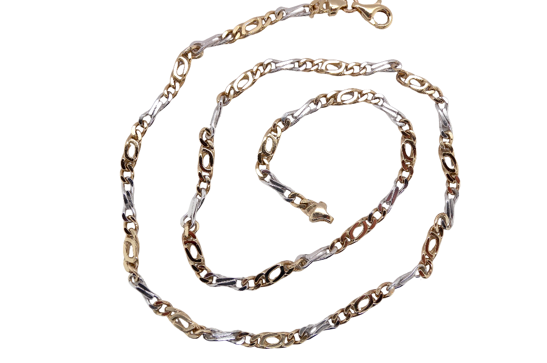 A heavy 9 carat gold neck chain. Two colour gold, white and yellow