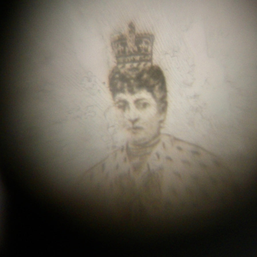 A highly unusual and collectable silver charm. Binoculars that show Edward VII and his wife Alexandra (daughter of Christian of Denmark) when viewed through the lens image 2