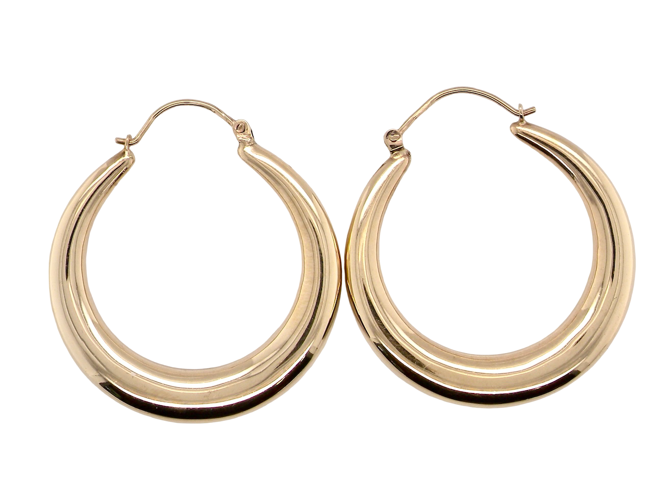 Gold hoop earrings on a white background