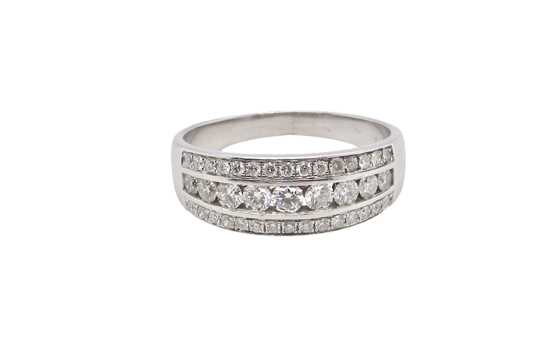 A lovely 18 carat white gold half hoop ring. Set with a middle row of nine bright white brilliant cut diamonds, graduate from 2.2mm to 2.6mm. The top and bottom rows are also set with small diamonds.