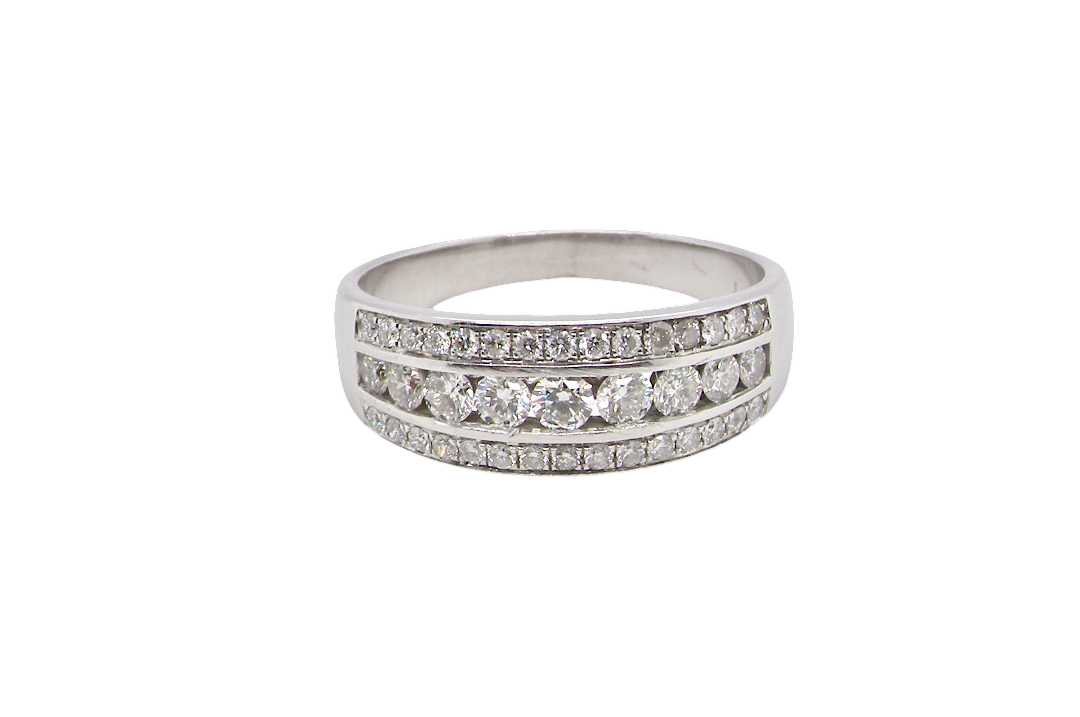 A lovely 18 carat white gold half hoop ring. Set with a middle row of nine bright white brilliant cut diamonds, graduate from 2.2mm to 2.6mm. The top and bottom rows are also set with small diamonds.