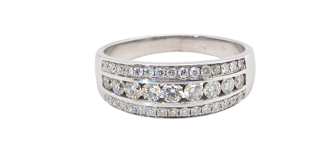A lovely 18 carat white gold half hoop ring. Set with a middle row of nine bright white brilliant cut diamonds, graduate from 2.2mm to 2.6mm. The top and bottom rows set with small diamonds.