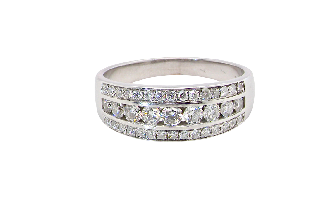 A lovely 18 carat white gold half hoop ring. Set with a middle row of nine bright white brilliant cut diamonds, graduate from 2.2mm to 2.6mm. The top and bottom rows set with small diamonds.