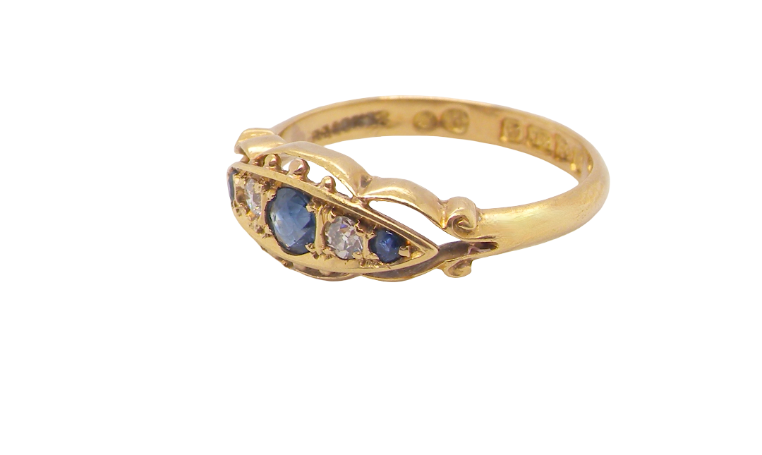 A lovely antique ring from the Edwardian period. Hallmarked in Chester in 1909 this ring typical for the period is set with sapphires and diamonds.
side