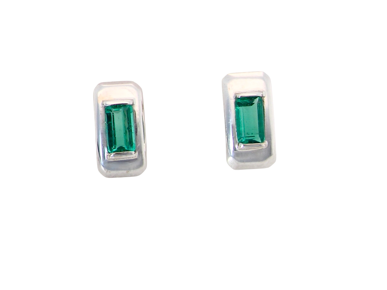 A lovely modern pair of earrings. Each emerald is rectangular, step cut,