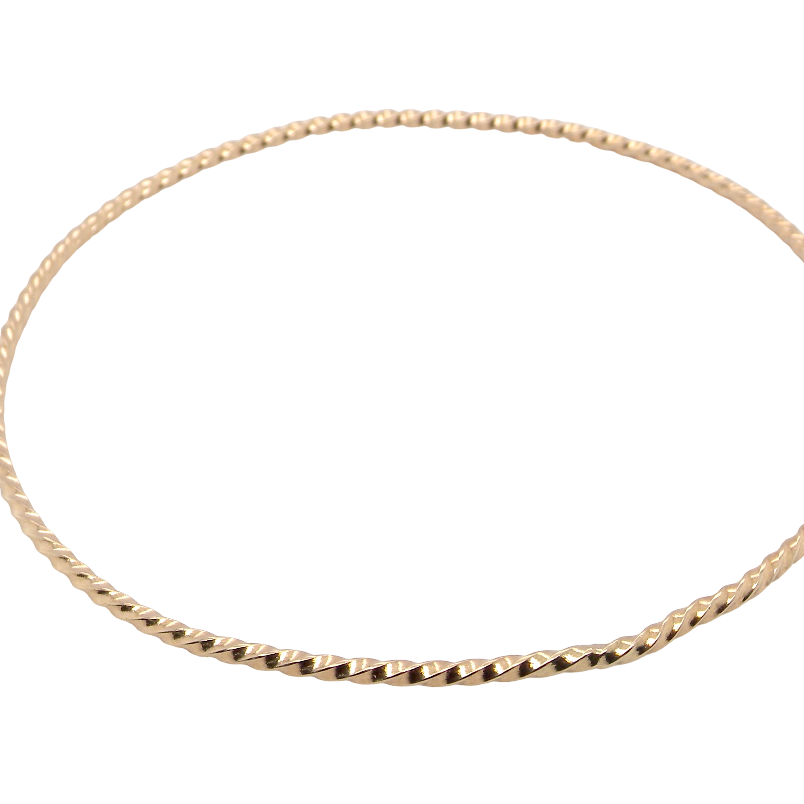 A lovely 9 carat gold wrist bangle . Barley twist design, solid not hollow, just