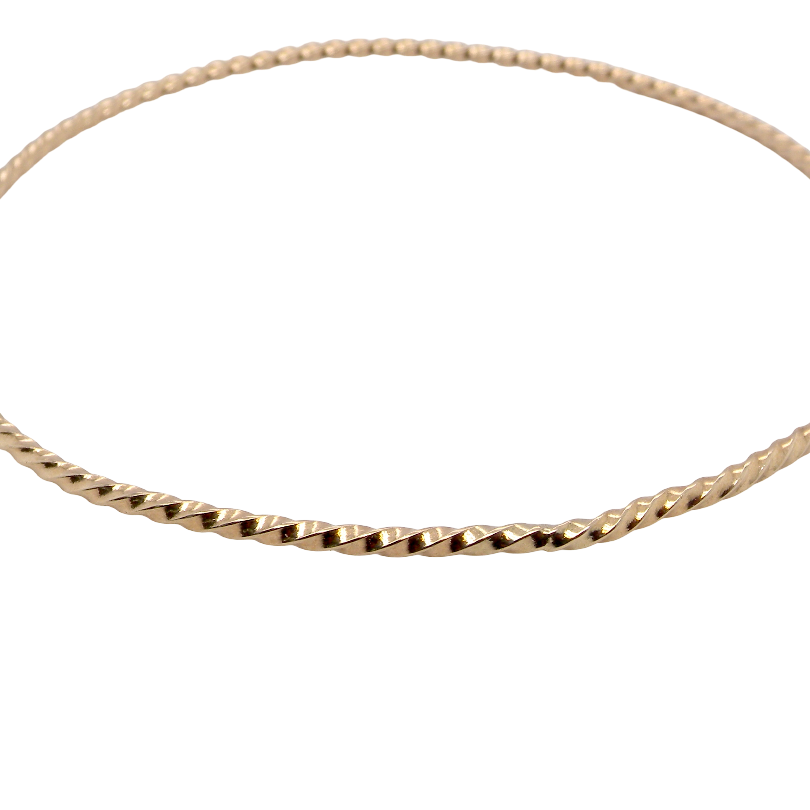 A lovely 9 carat gold wrist bangle . Barley twist design, solid not hollow, just under 2mm width.