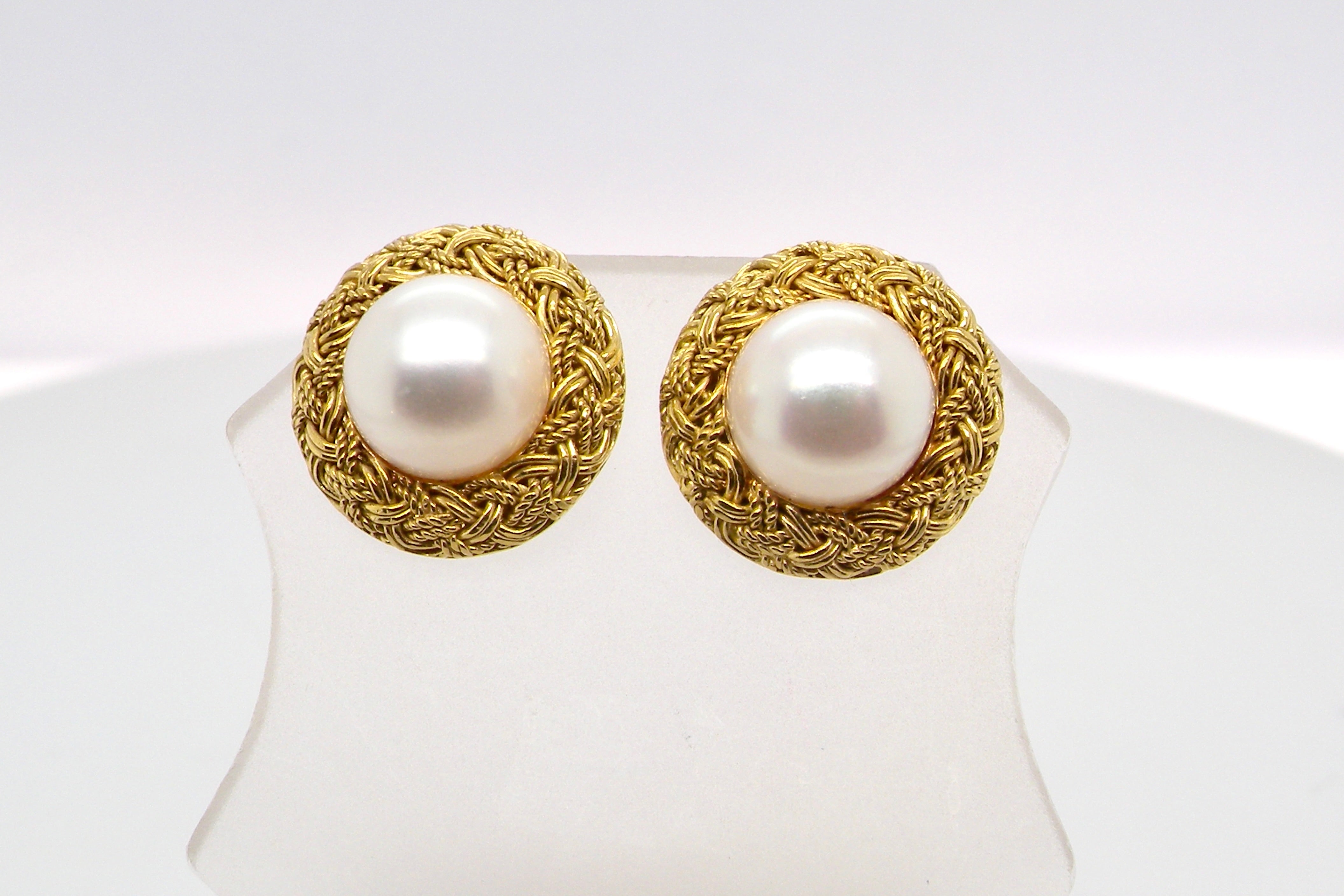 A lovely pair of elegant earrings, each set with a 7.7 mm cultured pearl.