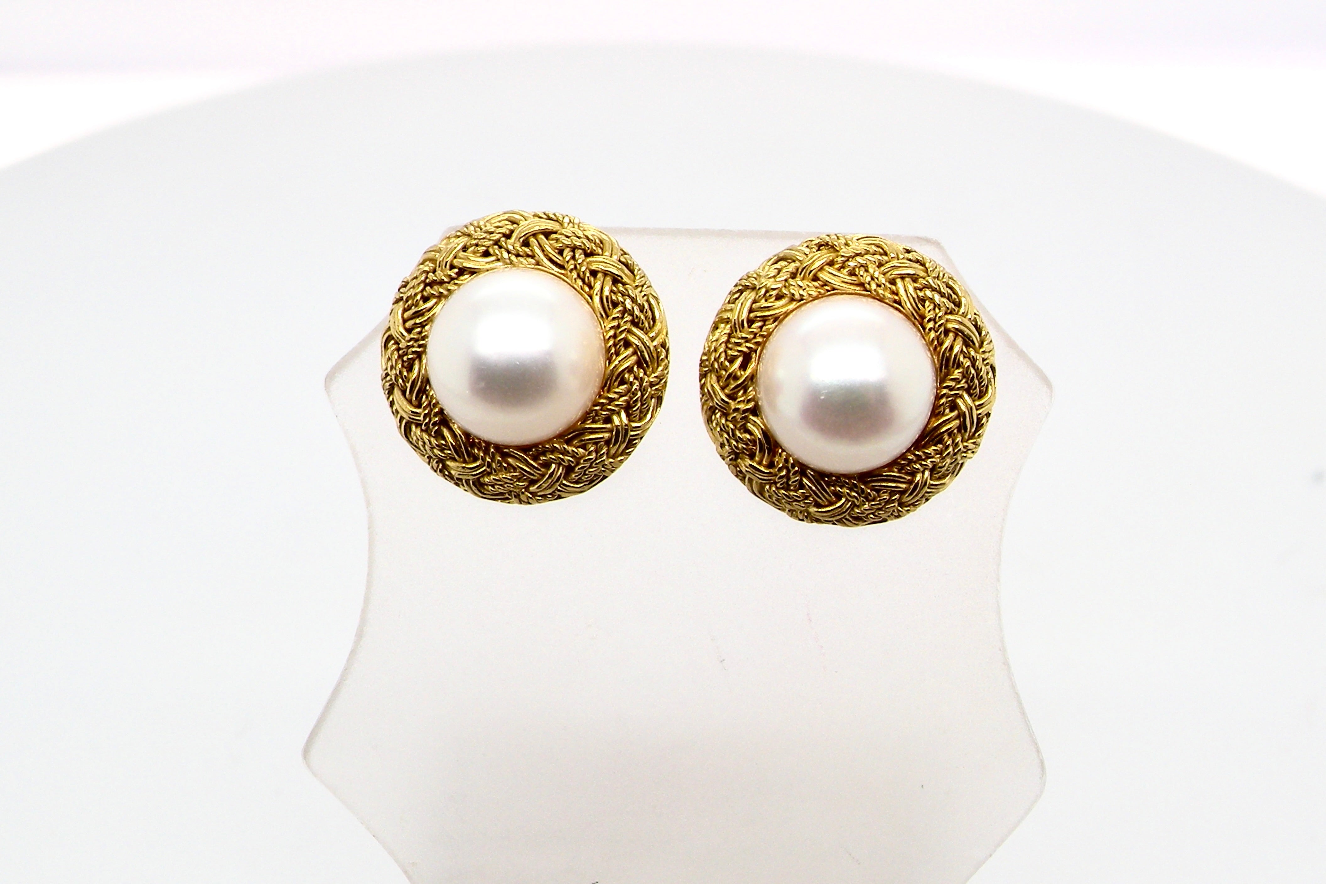 A lovely pair of elegant earrings, set with a 7.7 mm cultured pearl.