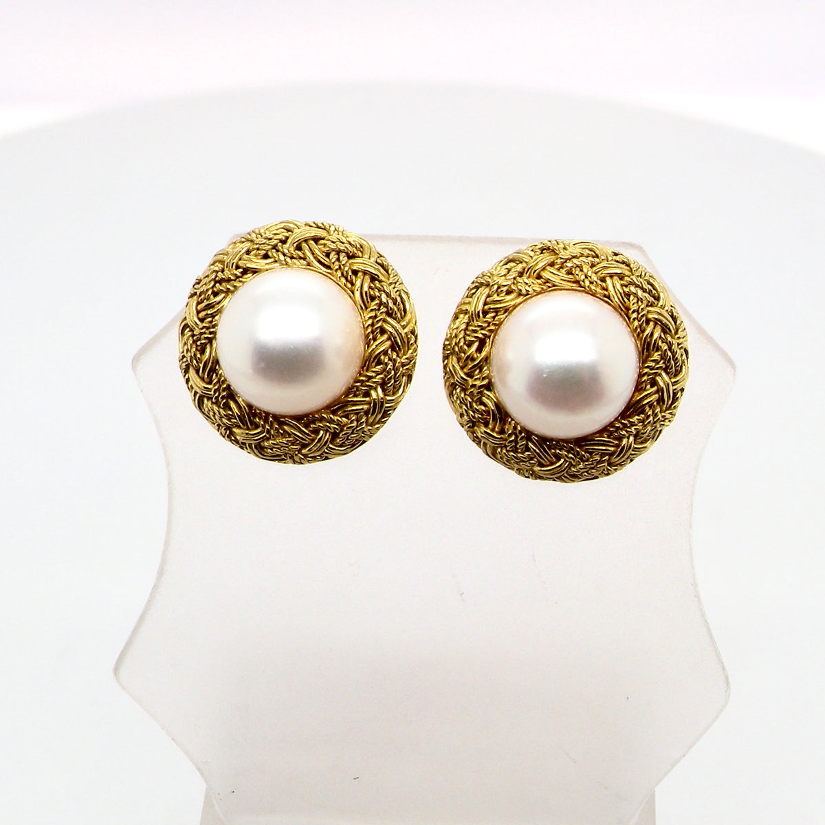 A lovely pair of elegant earrings, set with a 7.7 mm cultured pearl.