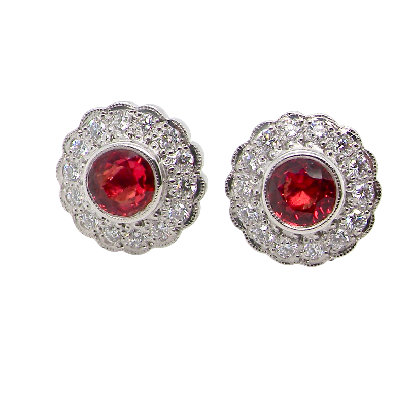 A lovely pair of stud earrings. Each features an unusual colour sapphire, fireglow orange. A deep orange hue, measures 5mm