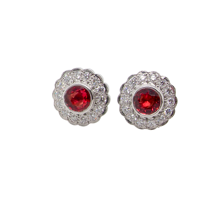 A lovely pair of stud earrings. Each features an unusual colour sapphire, fireglow orange. A deep orange hue, measures 5mm (est 0.50 carats)