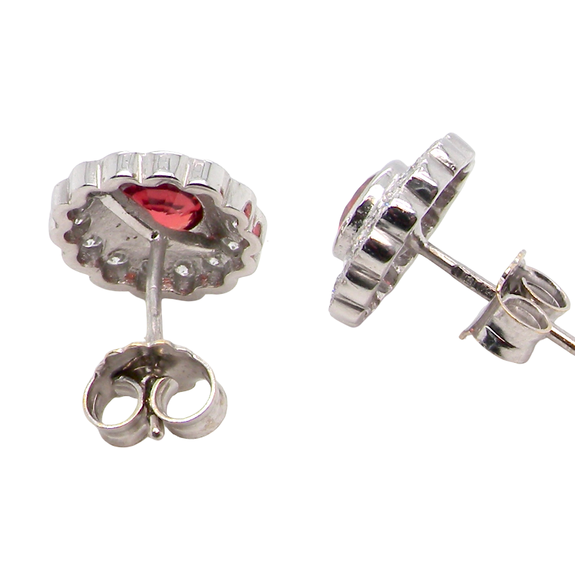 rear A lovely pair of stud earrings. Each features an unusual colour sapphire, fireglow orange. A deep orange hue, measures 5mm (est 0.50 carats)