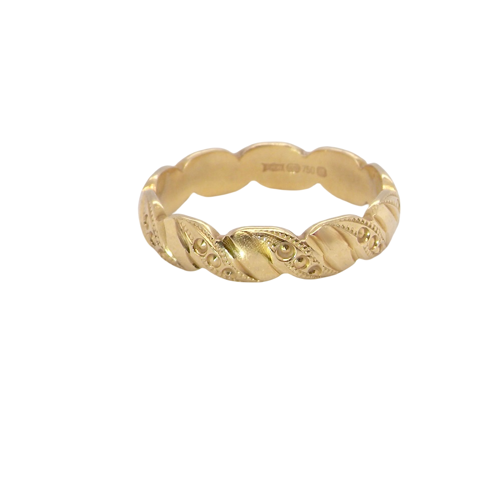 A lovely wedding ring, scalloped edges with dotted patterns around the body of the ring.