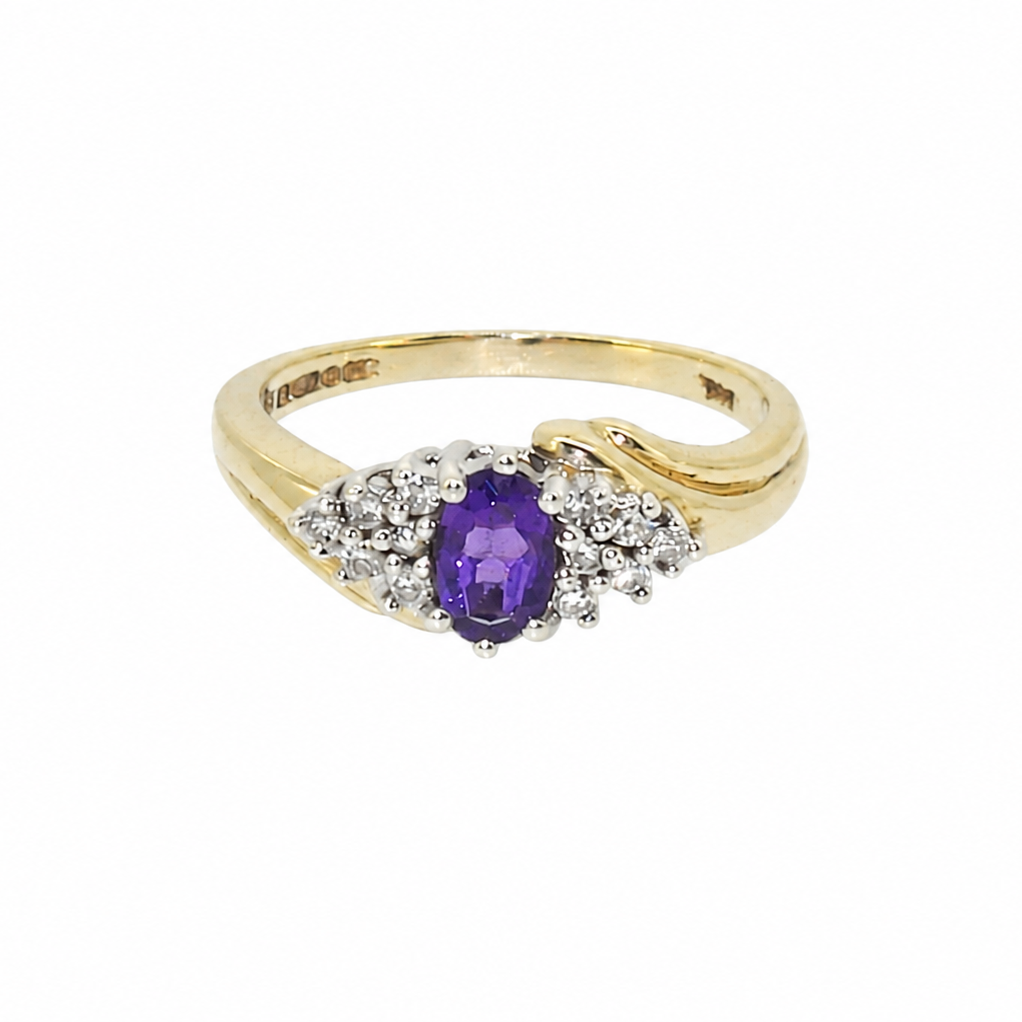 A marquise amethyst diamond cluster ring