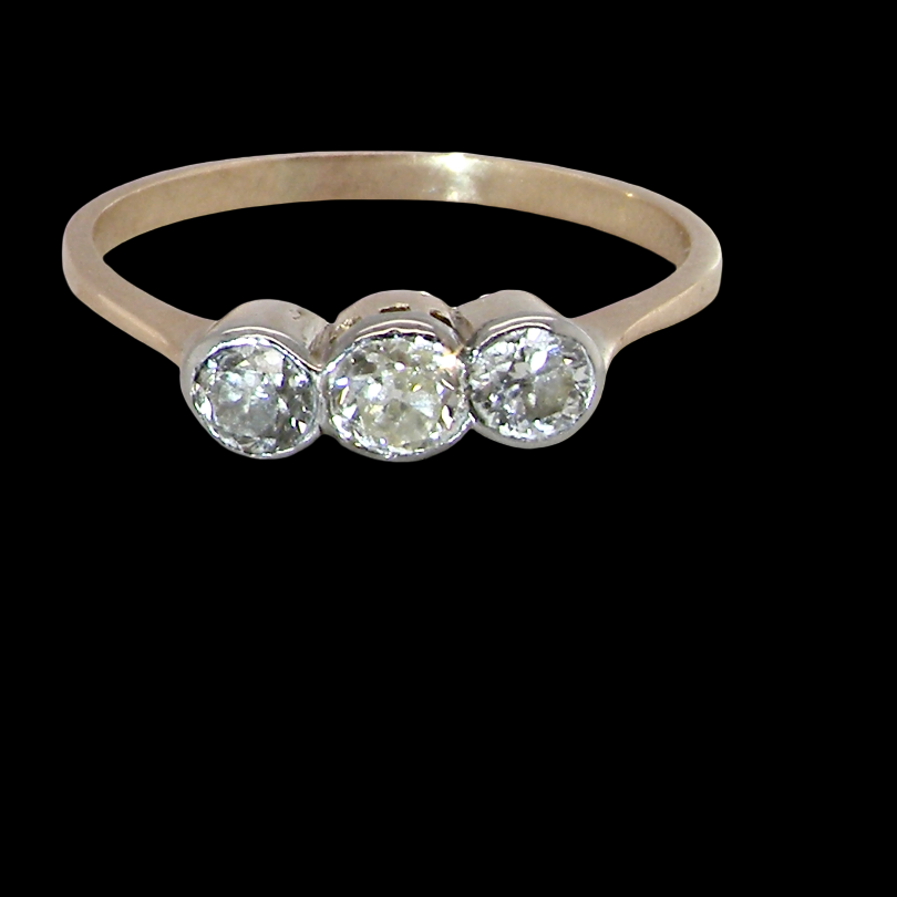 A mid to early 20th century trilogy ring set with three old brilliant cut white diamonds.