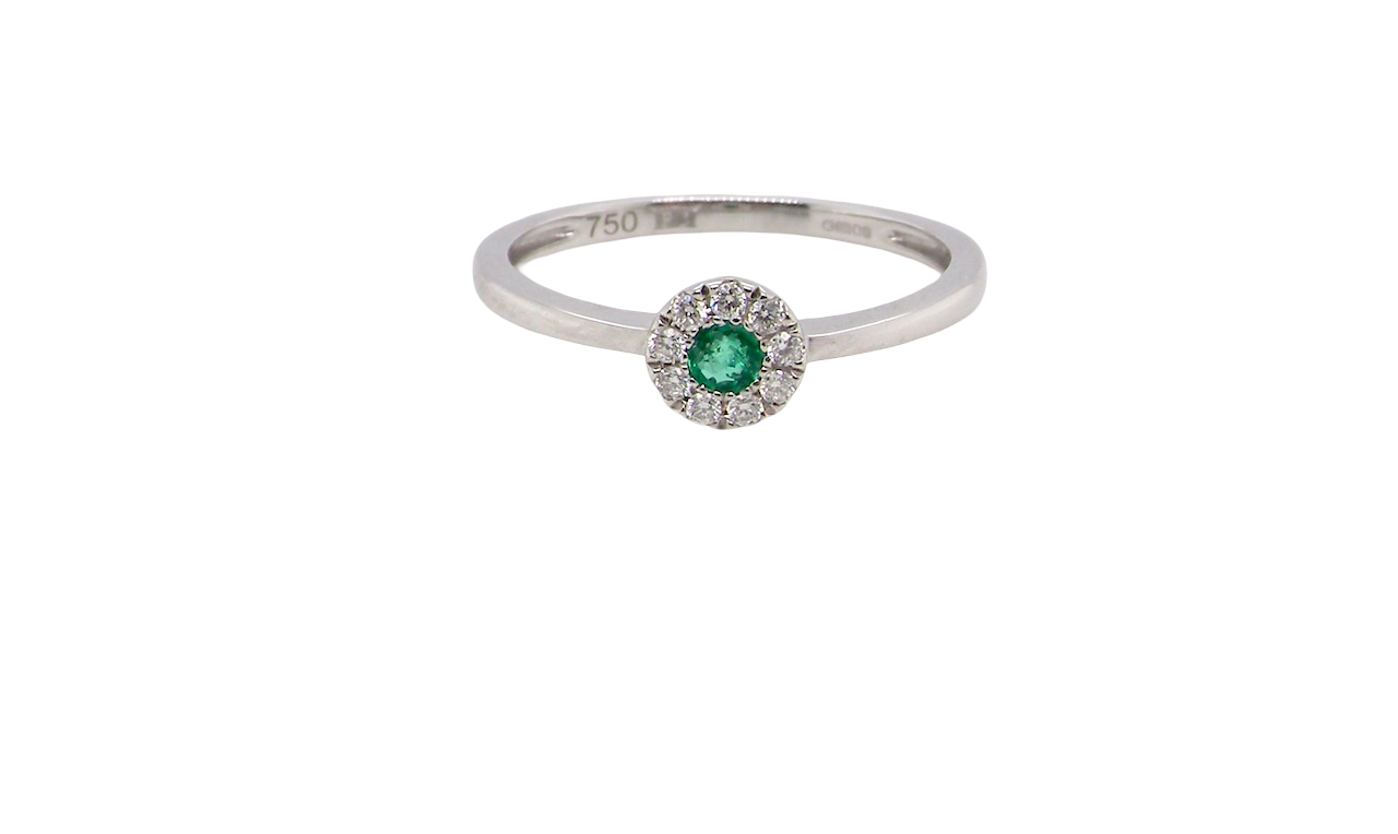 A mini cluster fashioned in 18 carat white gold. The round emerald measures 2.7mm (0.05 carats) 