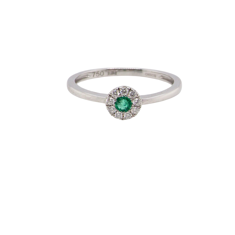 A mini cluster fashioned in 18 carat white gold. The round emerald measures 2.7mm (0.05 carats) 