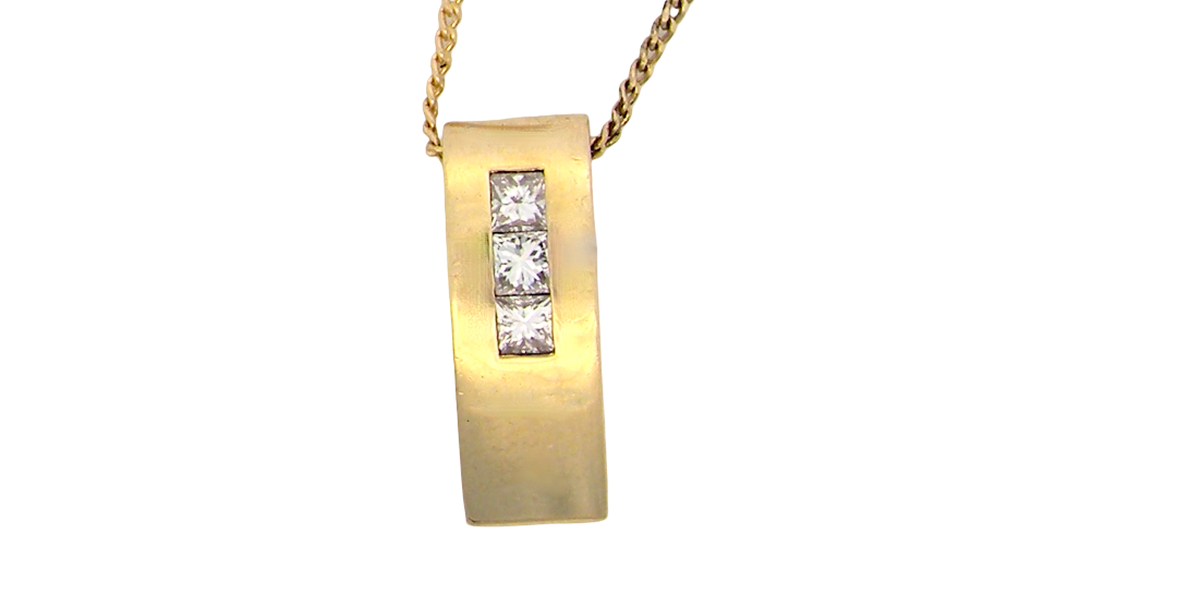 A modern block style pendant. Measures 17x6.3mm. Set with three princess cut white diamonds, close set, each measures 2.75-2.85mm