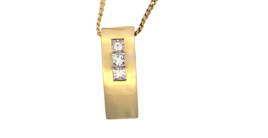 A modern block style pendant. Measures 17x6.3mm. Set with three princess cut white diamonds, close set, each measures 2.75-2.85mm