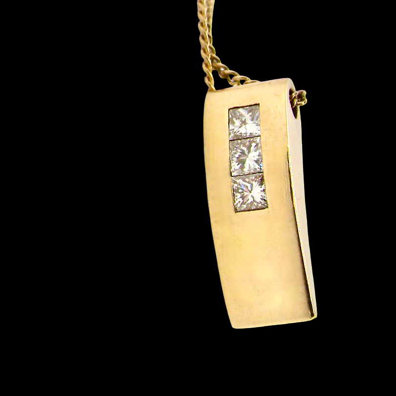 side view A modern block style pendant. Measures 17x6.3mm. Set with three princess cut white diamonds, close set, each measures 2.75-2.85mm (total est 0.40 carats). 