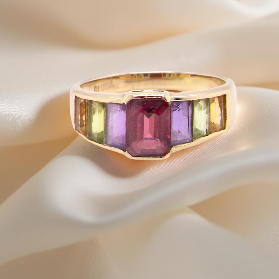 A multi gemstone dress ring