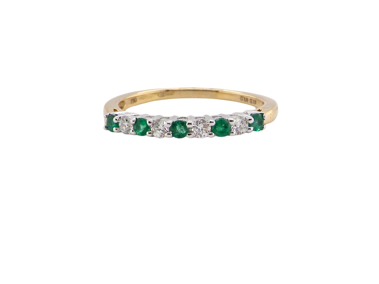 An 18 carat gold Emerald and Diamond eternity ring