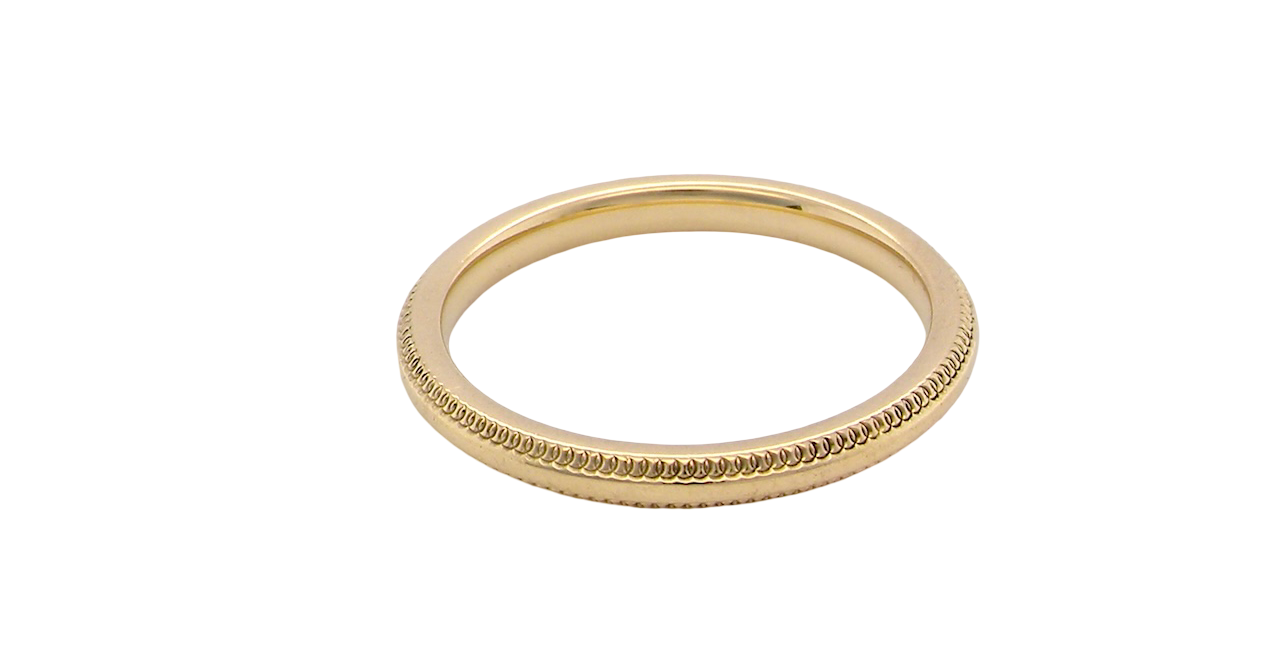 A narrow 18 carat gold wedding ring bead design