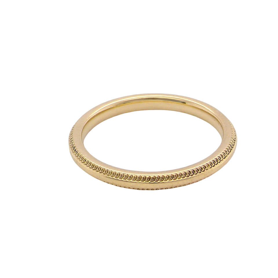 A narrow 18 carat gold wedding ring bead design