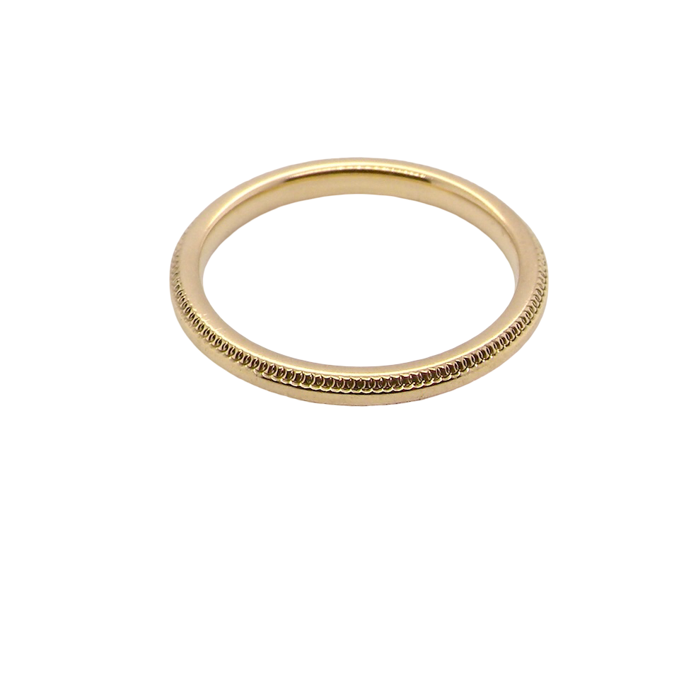 A narrow 18 carat gold wedding ring bead pattern