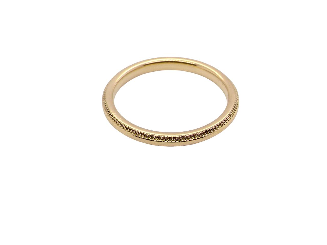 A narrow 18 carat gold wedding ring bead pattern
