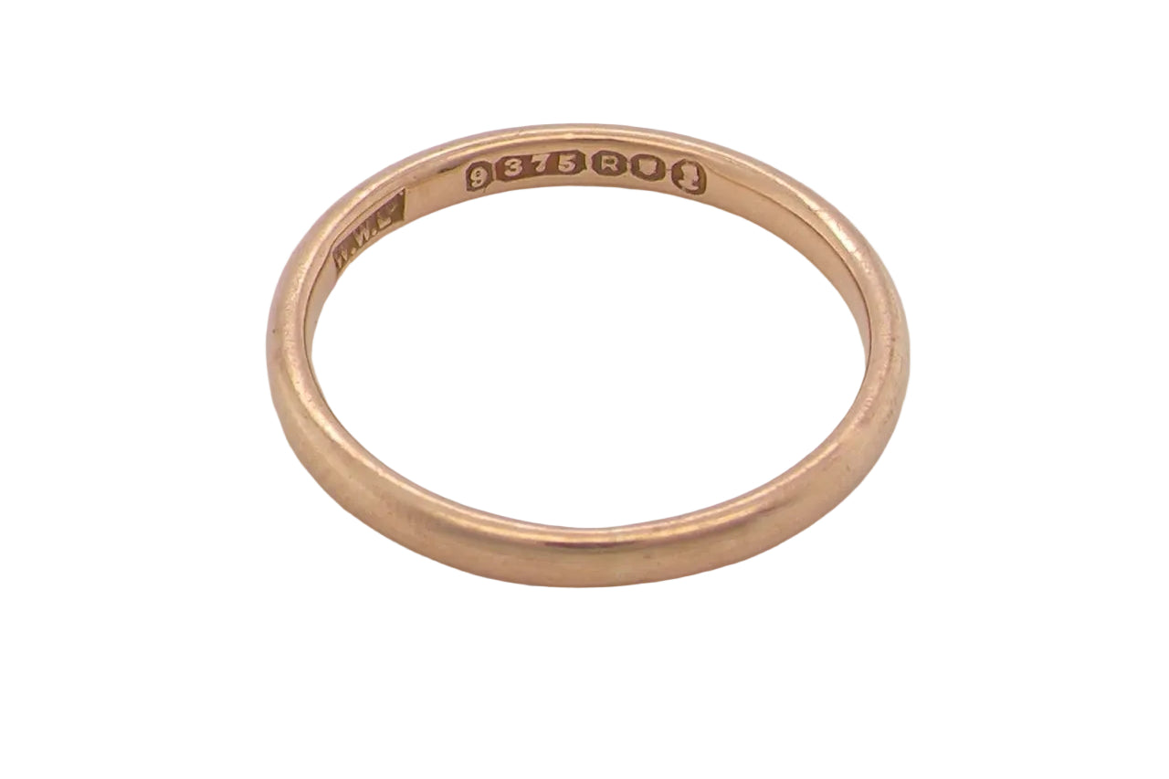 A narrow 9 carat gold wedding ring. D shape profile.
Width just over 2mm,