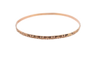 A narrow gold bangle