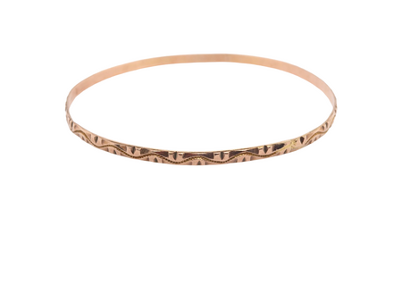 A narrow gold bangle